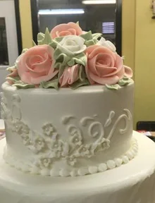 Tiered wedding cake with sugar roses
